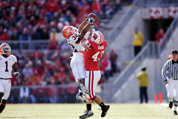 October 28, 2006; Madison, WI, USA; Wisconsin Badgers tight end (43) Andy Crooks and Illinois defensive back (32) Justin Harrison battle for a pass during the first quarter at Camp Randall Stadium. Mandatory Credit: Photo By Jeff Hanisch-USA TODAY Sports Copyright (c) 2006 Jeff Hanisch